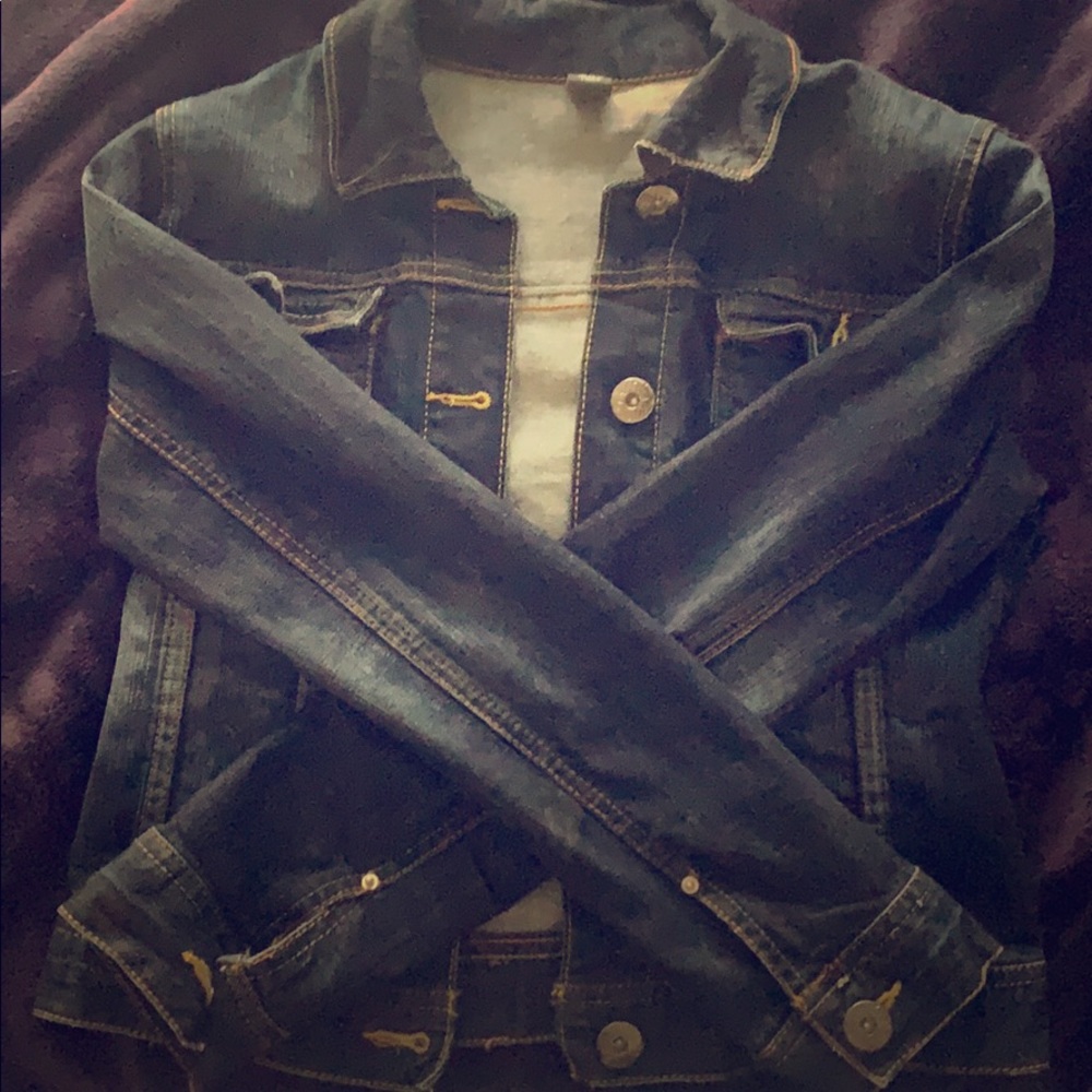 A dark wash denim jean jacket.